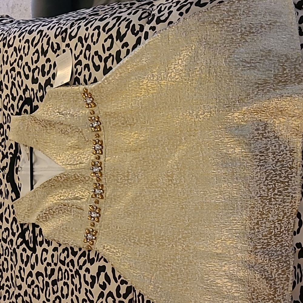 Beautiful gold sleeveless plunge neckline Aline dress.